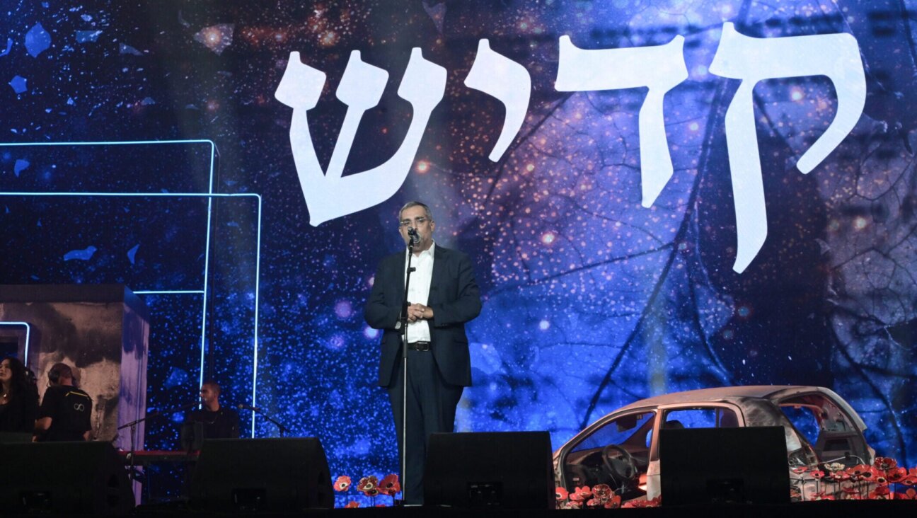 Elchanan Danino, whose son was murdered in captivity in Gaza, leads the Mourner’s Kaddish at the civilian Oct. 7 memorial ceremony at Hayarkon Park in Tel Aviv, Oct. 7, 2025. 