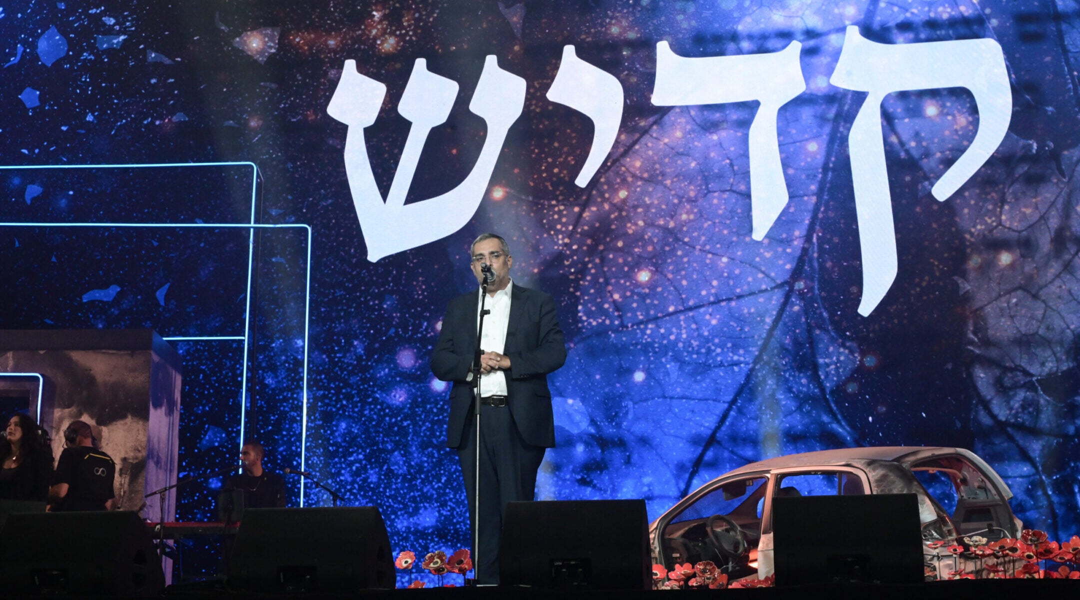 Elchanan Danino, whose son was murdered in captivity in Gaza, leads the Mourner’s Kaddish at the civilian Oct. 7 memorial ceremony at Hayarkon Park in Tel Aviv, Oct. 7, 2025. 