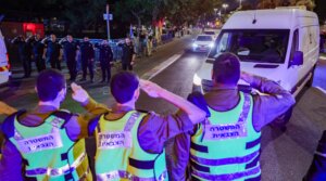 Israeli security forces pay respects as a convoy carrying the bodies of four hostages arrives at the Abu Kabir Forensic Institute in Tel Aviv, on Oct. 15, 2025. 