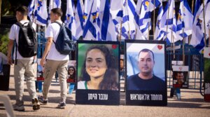 Posters of deceased hostages Inbar Hayman and Muhammad Al-Atarash stand in Hostage Squares in Tel Aviv after their release, Oct. 16, 2025. (Miriam Alster/Flash90)