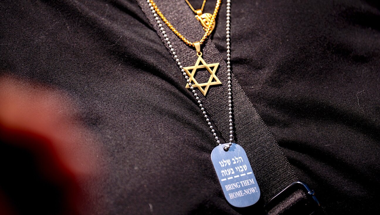 “Who do we become when we harden our hearts?” asked Rabbi Angela Buchdahl in a sermon. Above, a woman wears a Star of David and a necklace remembering the Israeli hostages during a rally at George Washington University, May 2, 2024.