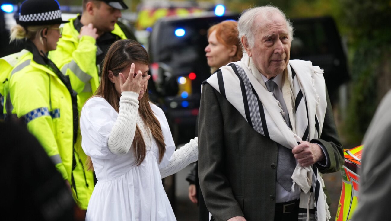 Members of the public and congregants seen as police and other emergency responders attend the Heaton Park Hebrew Congregation Synagogue following an attack on Yom Kippur, on Oct. 2, 2025.