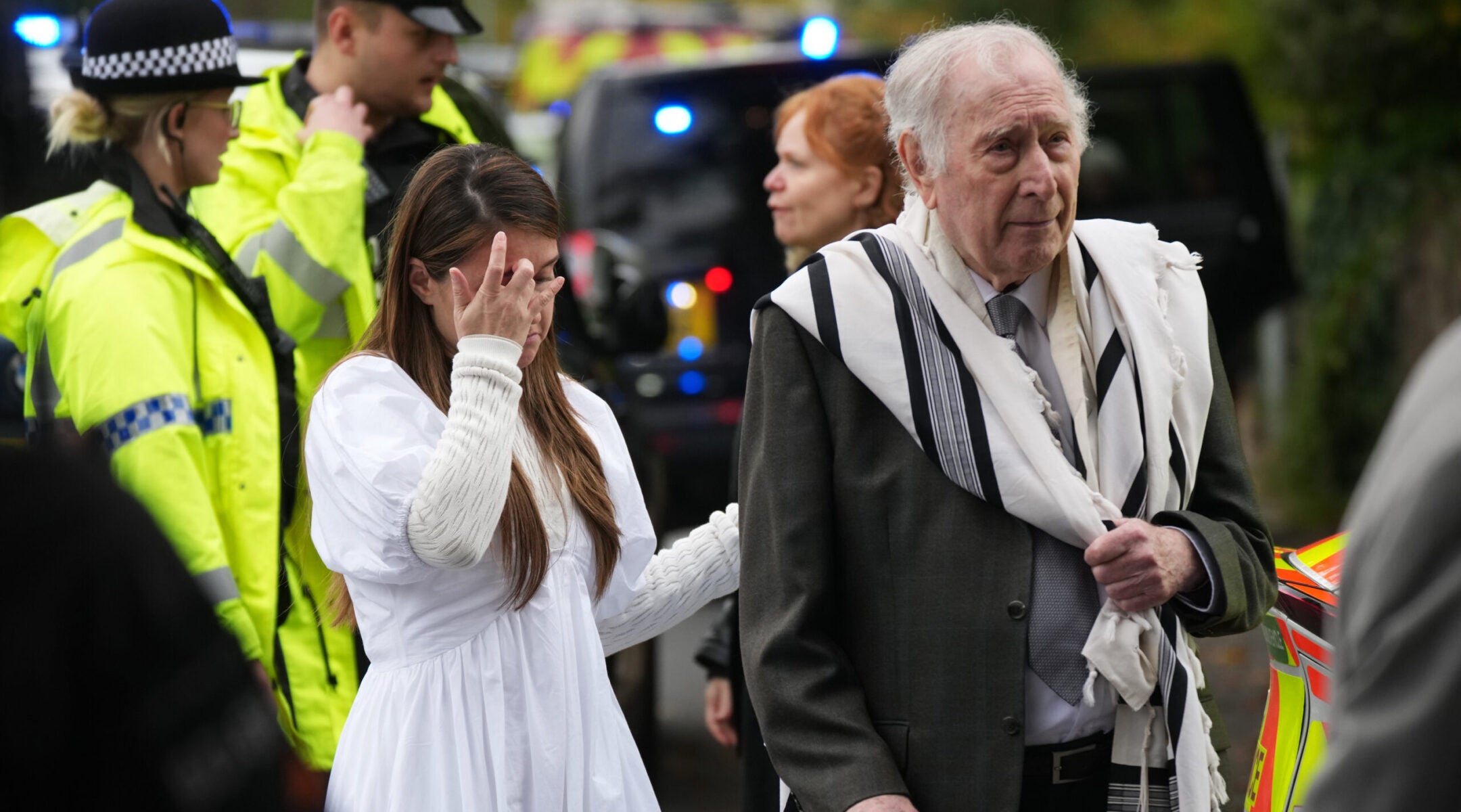 Members of the public and congregants seen as police and other emergency responders attend the Heaton Park Hebrew Congregation Synagogue following an attack on Yom Kippur, on Oct. 2, 2025.