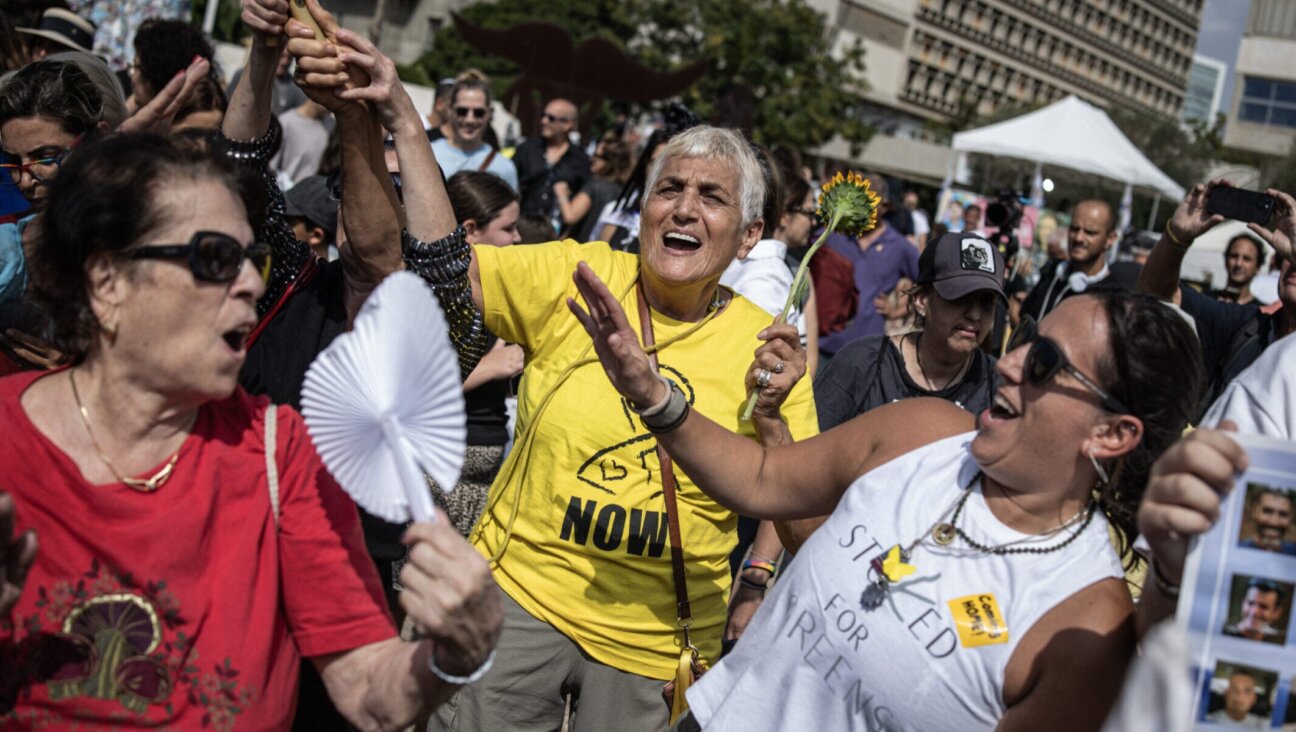 Tova Gohar, at center, joins the crowds of people celebrating news of a ceasefire deal at Hostages Square in Tel Aviv on Oct. 9, 2025.
