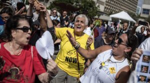 Tova Gohar, at center, joins the crowds of people celebrating news of a ceasefire deal at Hostages Square in Tel Aviv on Oct. 9, 2025.