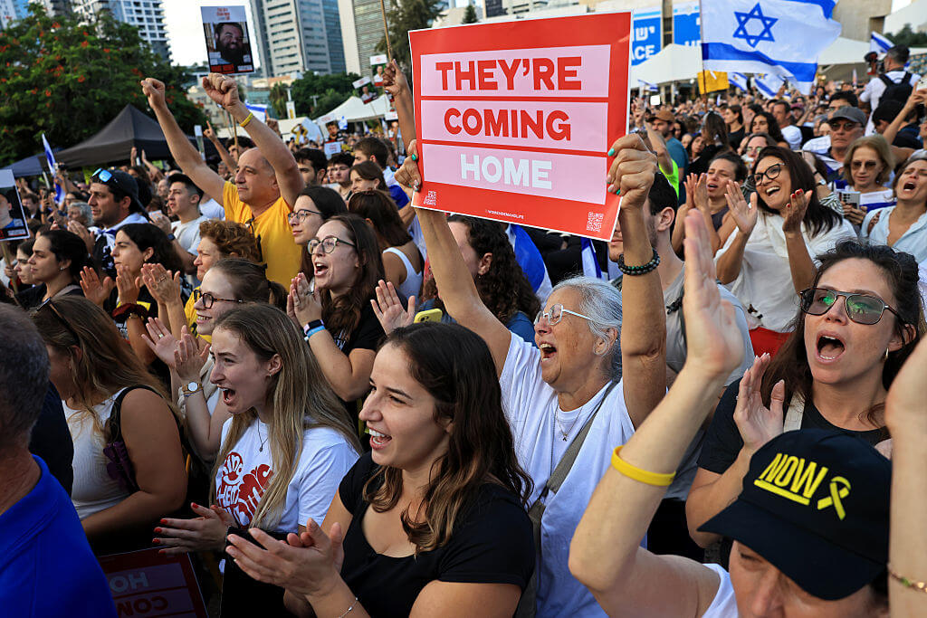 People react as they watch the hostage release live stream at Hostages Square on October 13, 2025 in Tel Aviv, Israel. 