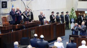 U.S. President Donald Trump arrives with Knesset Speaker Amir Ohana and Israel’s President Isaac Herzog to speak to the Knesset, Israel’s parliament, on Oct. 13, 2025 in Jerusalem. 