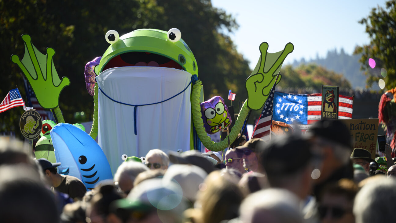 A demonstrators in a frog costume attends a 'No Kings' march in Portland, Oregon.
