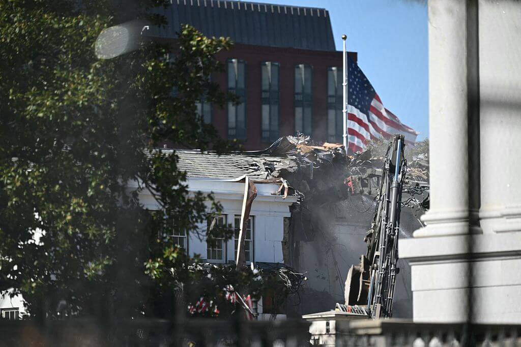 Heavy machinery tears down a section of the East Wing of the White House as construction begins on President Donald Trump's planned ballroom, in Washington, D.C., on October 21, 2025. 