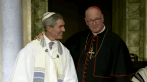 Rabbi Elliot Cosgrove, left, and Archbishop Timothy Dolan speak during Park Avenue Synagogue’s Yom Kippur services in New York City, Oct. 2, 2023. 