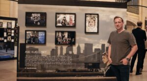 Abe Kugielsky poses in front of his installation at Humans of New York’s “Dear New York” exhibition in Grand Central’s Vanderbilt Hall, running from Oct. 6 to Oct. 19. 