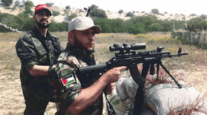 Mahmoud Amin Ya-qub Al-Muhtadi (left) allegedly conducts firearm training for the National Resistance Brigades. 