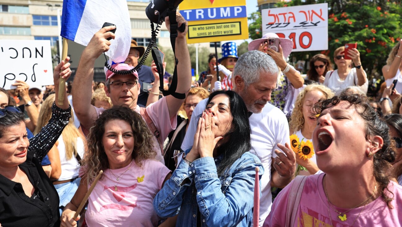 Einav Zangauker, the mother of hostage Matan Zangauker, celebrates as people react to the news of the Gaza peace deal at Hostages Square on October 9, 2025 in Tel Aviv, Israel.