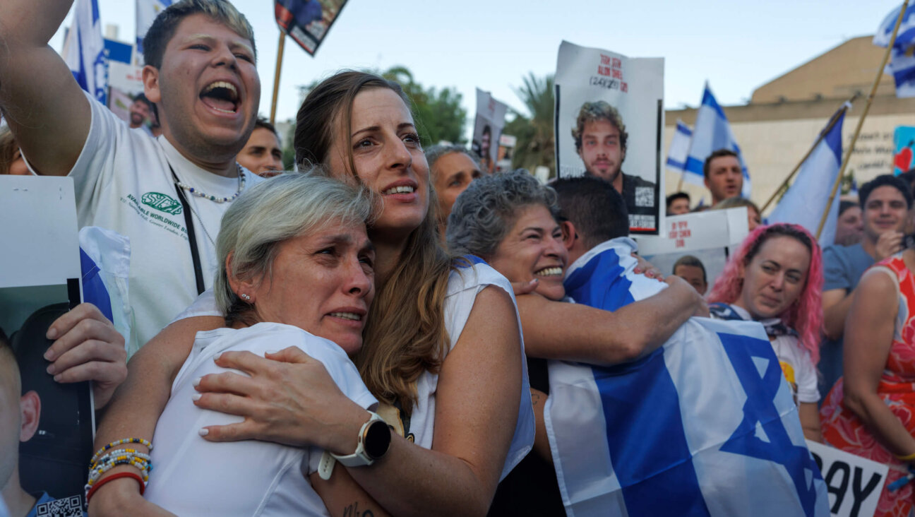 Israelis react as they watch the release of Israeli hostages by Hamas during a live broadcast in Tel Aviv, Israel, on Oct. 13.