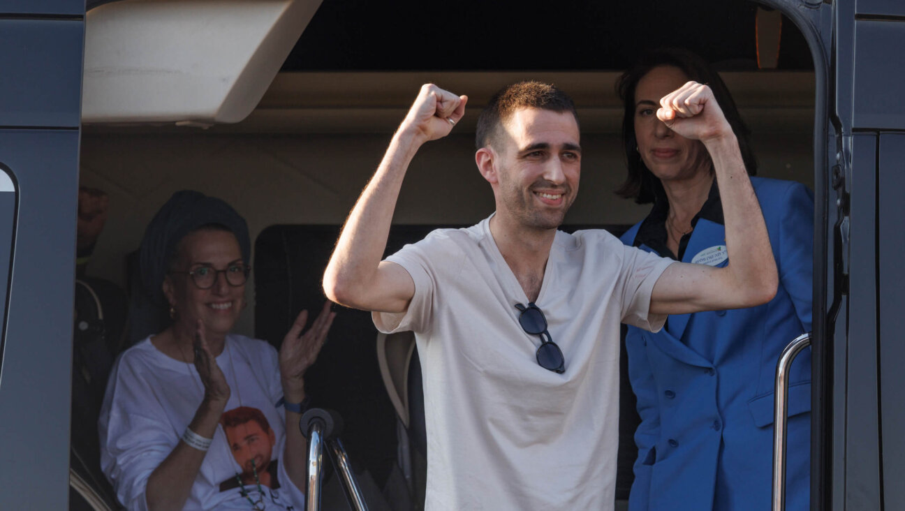Former Israeli hostage Avinatan Or gestures as he arrives at the Beilinson hospital in Petach Tikva, near Tel Aviv, Israel, on Oct. 13.