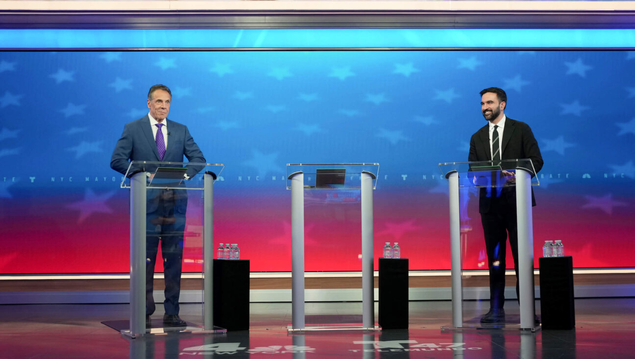 Former New York Gov. Andrew Cuomo, running as an Independent, and Democratic mayoral nominee Zohran Mamdani prepare for a mayoral debate on Oct. 16.
