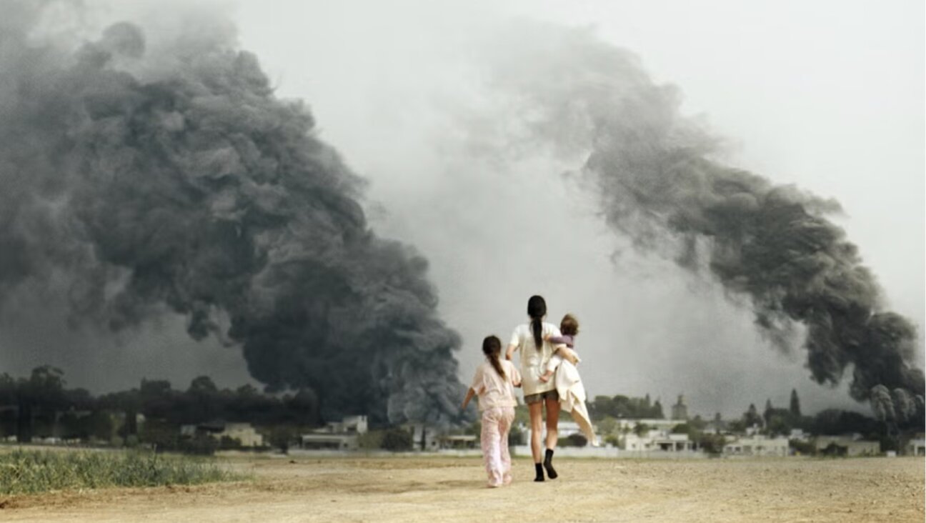 A scene from Red Alert, a mother and her two daughters walking back toward their ransacked kibbutz.