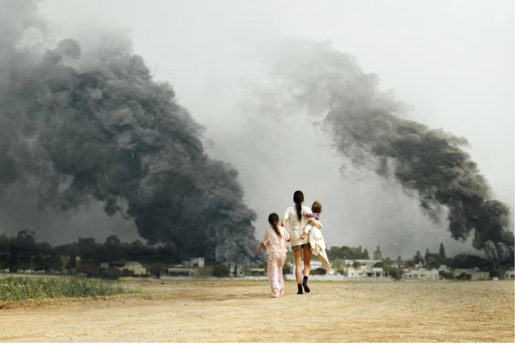 A scene from Red Alert, a mother and her two daughters walking back toward their ransacked kibbutz.