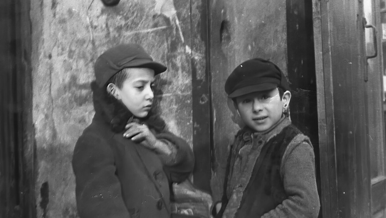 AI-enhanced image of children in the Jewish neighborhood of Warsaw, Poland before the Holocaust.  