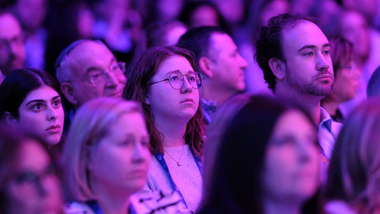 Audience members watch the opening plenary of the Jewish Federations of North America's annual conference in Washington, D.C. on Sunday.