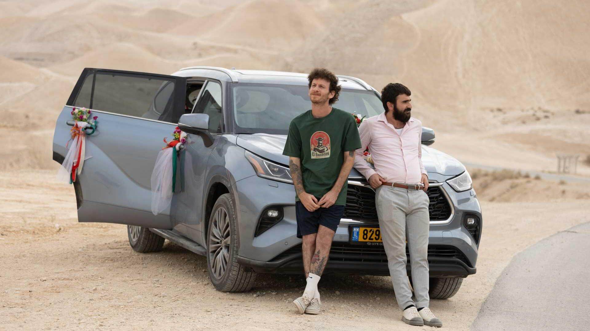 Elisha Banai (left) plays Yaki, a struggling musician searching for a dove with the help of Bilal, played by Hanna Birakh (right), in <i>Bella</i>.