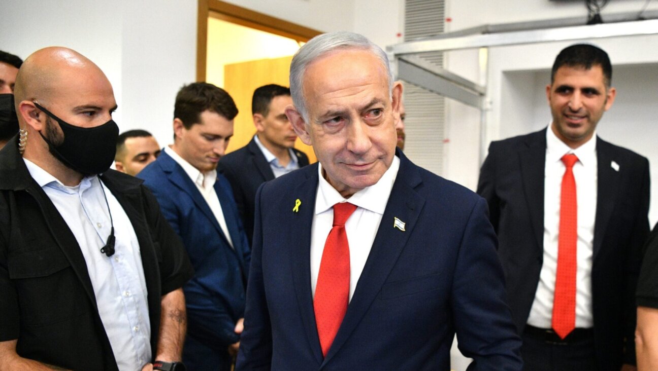 Israeli Prime Minister Benjamin Netanyahu arrives in a courtroom at the District Court in Tel Aviv, in the trial against him, Oct. 15, 2025.