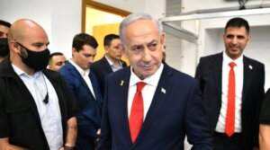 Israeli Prime Minister Benjamin Netanyahu arrives in a courtroom at the District Court in Tel Aviv, in the trial against him, Oct. 15, 2025.