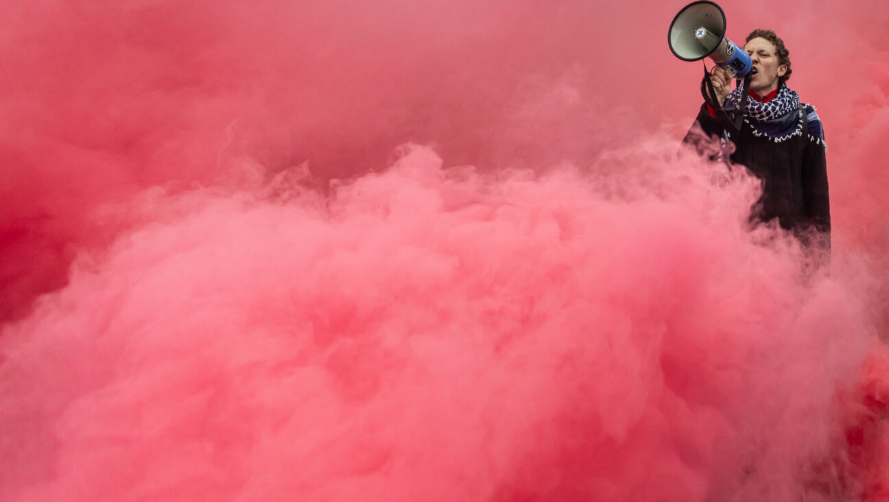 Flares like the ones used at a concert by Andras Schiff and the Israel Philharmonic have become common in protests, like this one in support of Palestinians in Warsaw, on Oct. 12, 2025.