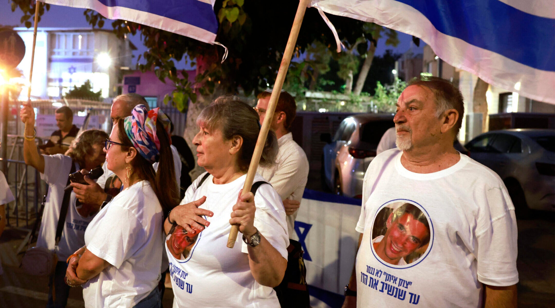 Israelis wearing shirts bearing the image of Hadar Goldin wait for the arrival of his body outside the National Center for Forensic Medicine in Tel Aviv on Nov. 9.