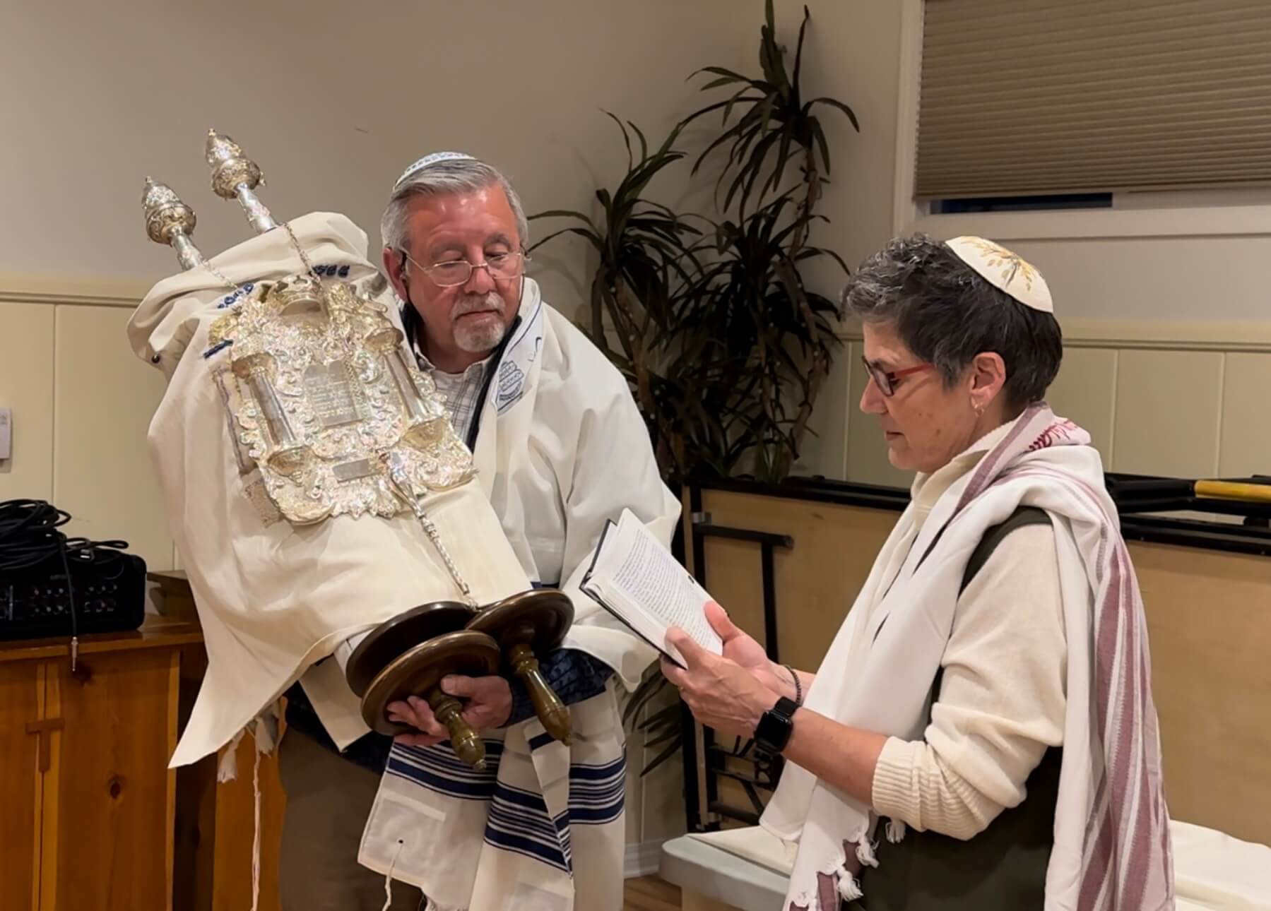 Joe Martin holds the Torah for the first time during his welcoming ceremony, where he was introduced to the congregation as having completed his conversion.