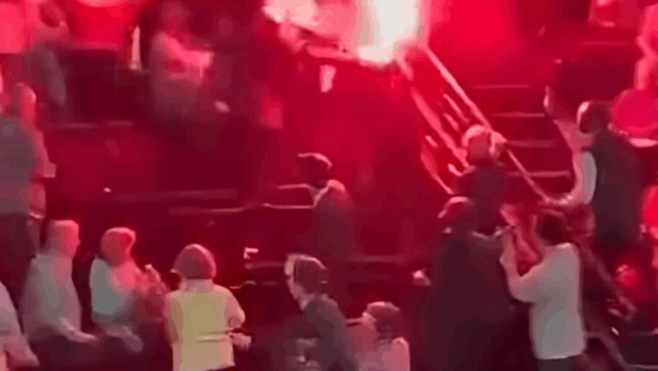 Pro-Palestinian protesters lit flares that interrupted a performance of the Israel Philharmonic in Paris on Nov. 6, 2025. 