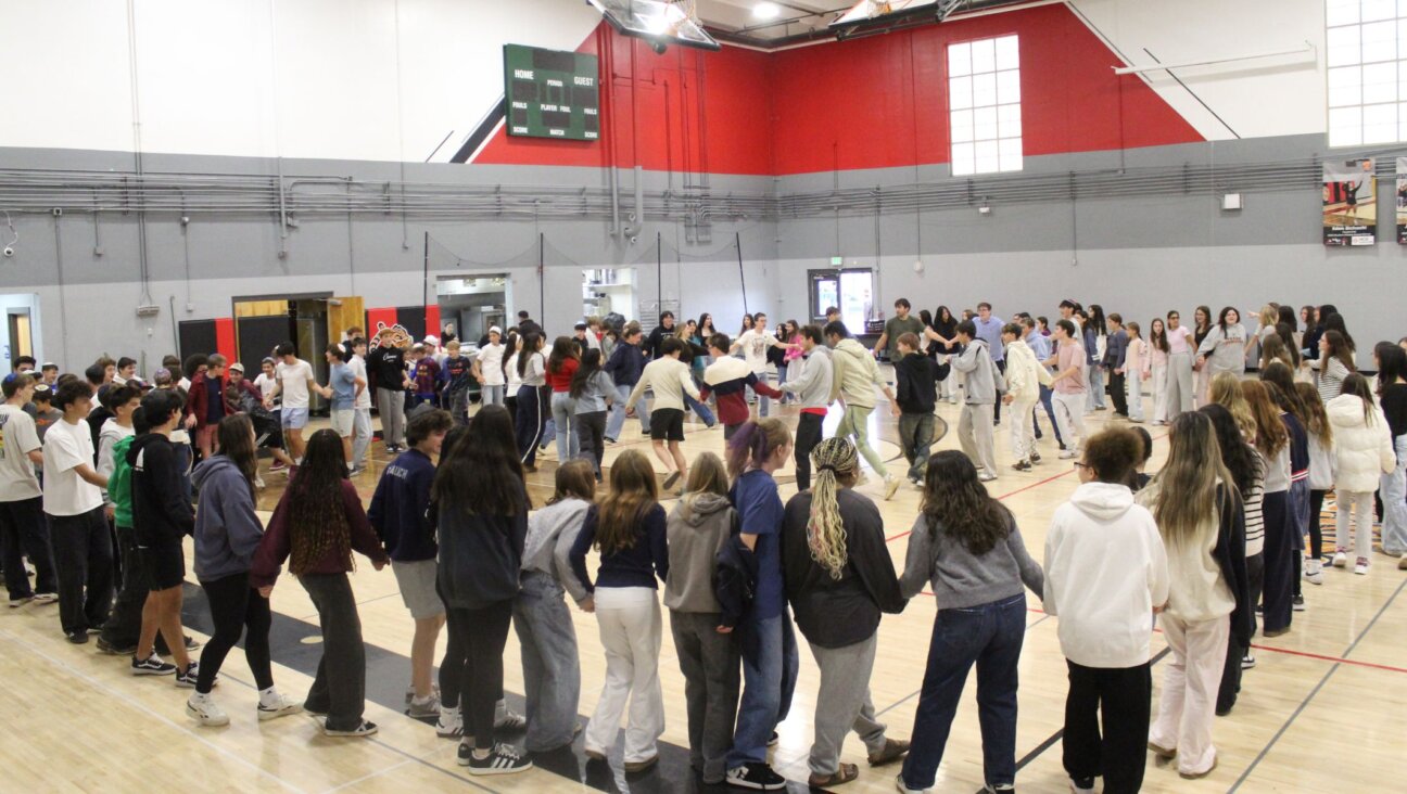 Students gather in the gym for a Rosh Chodesh celebration at Denver Jewish Day School, an event that now fills the space as enrollment continues to rise. 