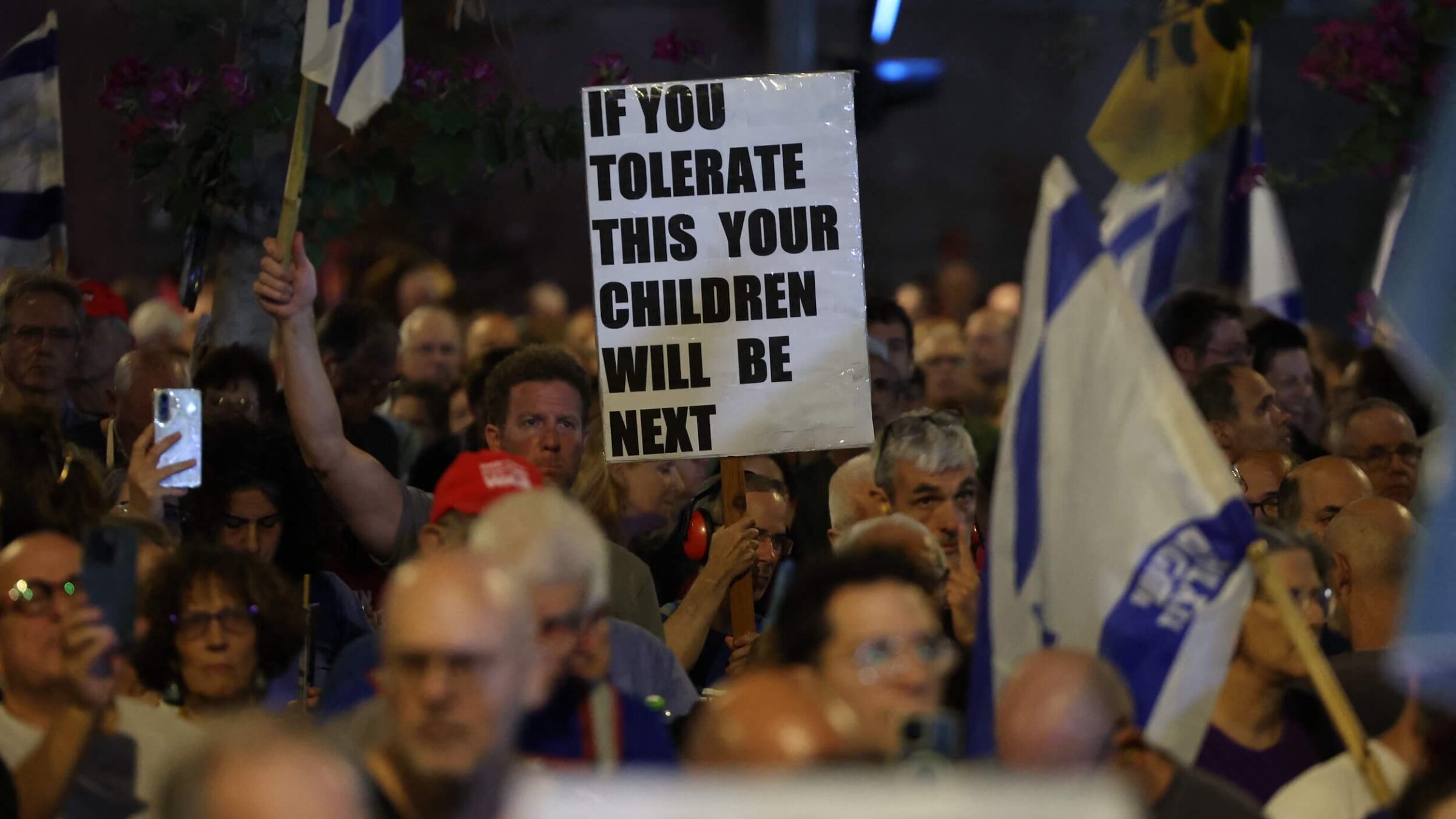 Israeli anti-government protesters at a demonstration against Prime Minister Benjamin Netanyahu demanding the establishment of a state commission of inquiry into the events of October 7, in Tel Aviv on Nov. 8.