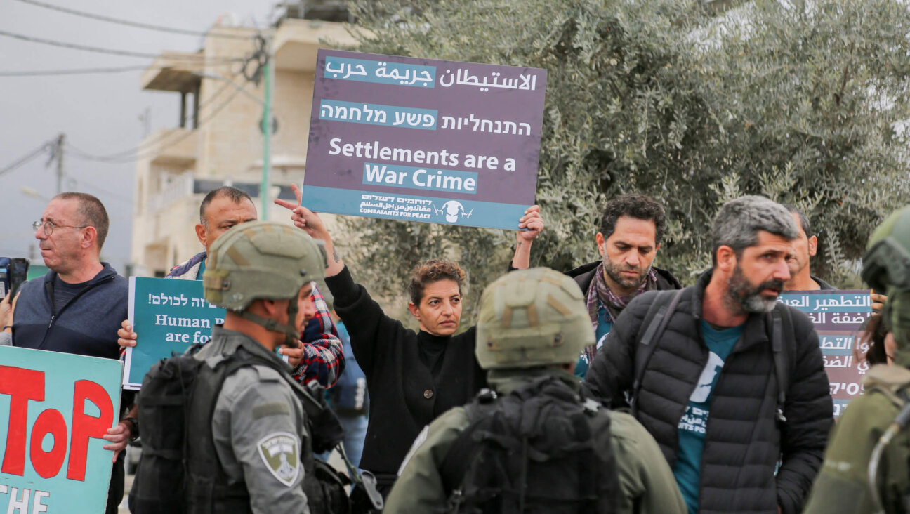 Israeli and Palestinian activists argue with members of Israel's security forces during a protest against Israeli settler violence at the north entrance of Beit Jala, near Bethlehem in the occupied West Bank on Nov. 14.