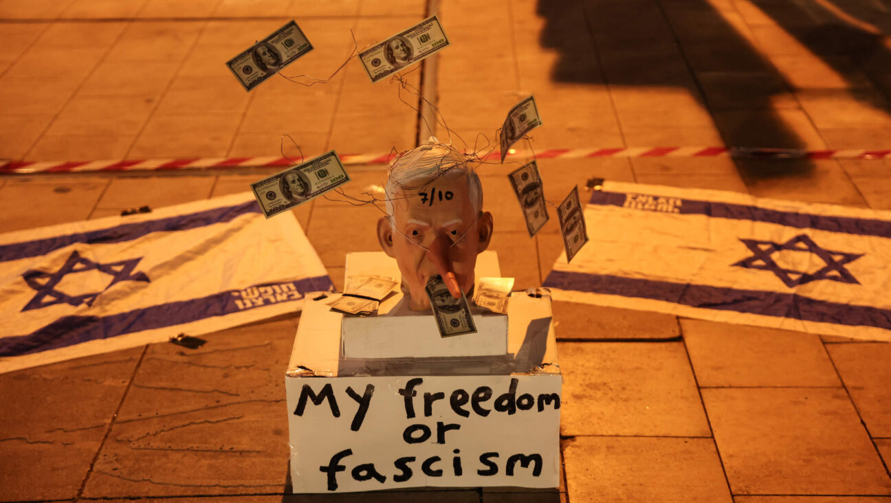 A mask mocking Israeli Prime Minister Benjamin Netanyahu is placed on the street during a demonstration in support of establishing a state commission of inquiry into Hamas' Oct. 7, 2023 attack.