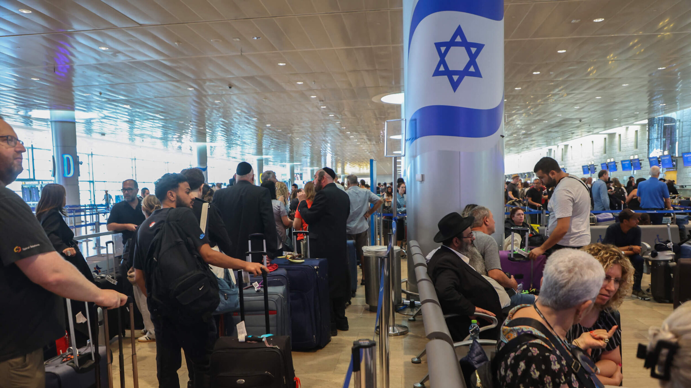 Passengers wait for flights at the Ben Gurion Airport in Tel Aviv.