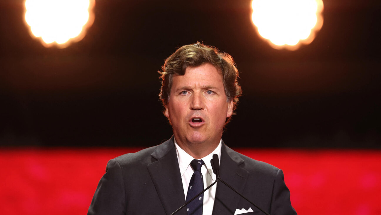 Tucker Carlson speaks during the public memorial service for right-wing activist Charlie Kirk in Glendale, Arizona, on Sept. 21.
