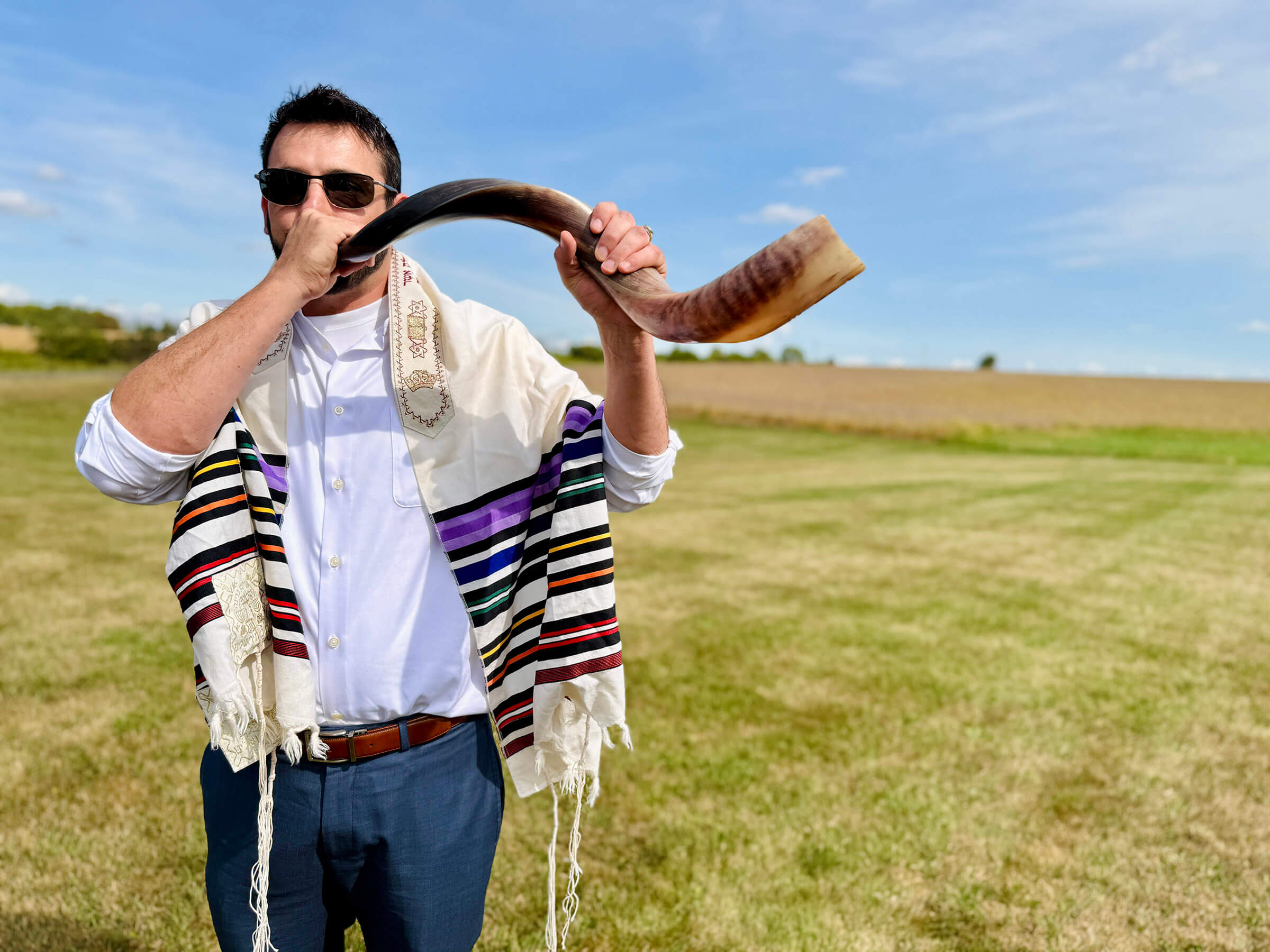 Nik Jakobs blew the shofar at a unique Rosh Hashanah service held in a field in northwestern Illinois.