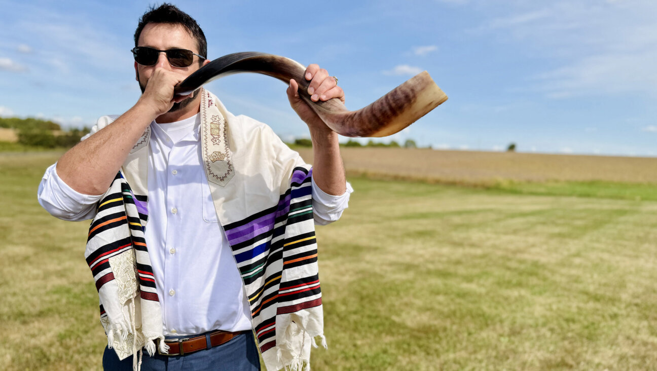 Nik Jakobs blew the shofar at a unique Rosh Hashanah service held in a field in northwestern Illinois.