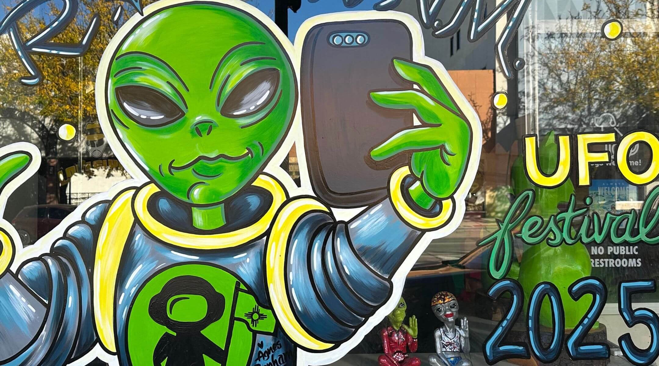 Storefront ad for the 2025 UFO Festival in Roswell, New Mexico.