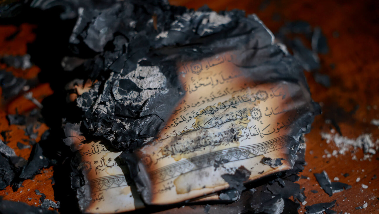 Burned copies of the Holy Quran are seen inside al-Hajje Hamide Mosque after Israeli settlers set fire to the building and scrawled racist slogans on its walls in the town of Deir Istiya, Salfit, West Bank, on Nov. 13.
