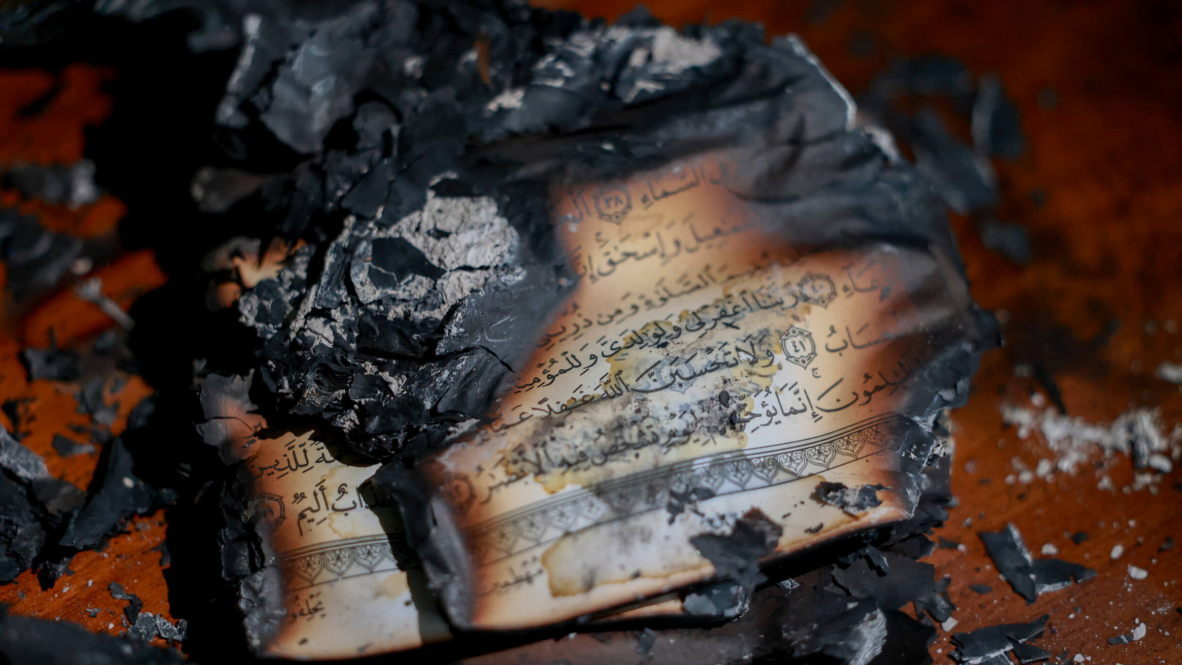 Burned copies of the Holy Quran are seen inside al-Hajje Hamide Mosque after Israeli settlers set fire to the building and scrawled racist slogans on its walls in the town of Deir Istiya, Salfit, West Bank, on Nov. 13.