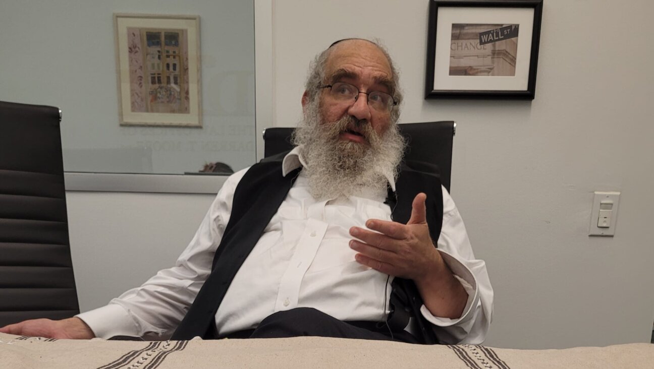 Sam Kellner poses in his attorney’s office in Brooklyn, nearly two decades into his legal journey as a whistleblower in his Hasidic community.