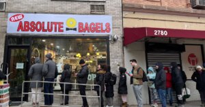 A line forms outside New Absolute Bagels on Tuesday morning, the shop's second day in business. 