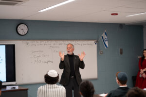 CUNY chancellor Félix Matos Rodríguez speaks to a classroom of students at Yeshivah of Flatbush Joel Braverman High School.