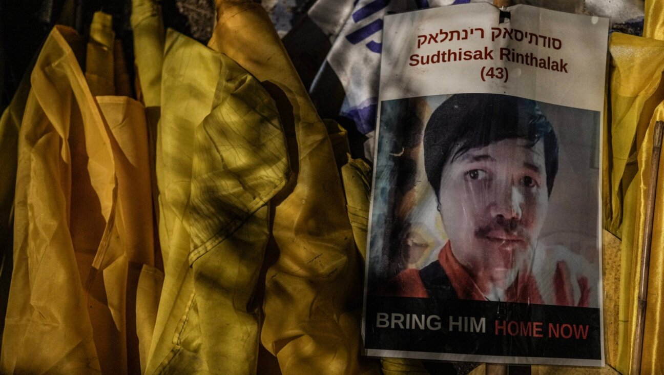 Israelis attend a rally outside the southern Israeli city of Sderot, calling for the release of slain hostages Ran Gvili and Sudthisak Rinthalak, whose bodies are still held by Hamas in Gaza, Nov. 29, 2025. 