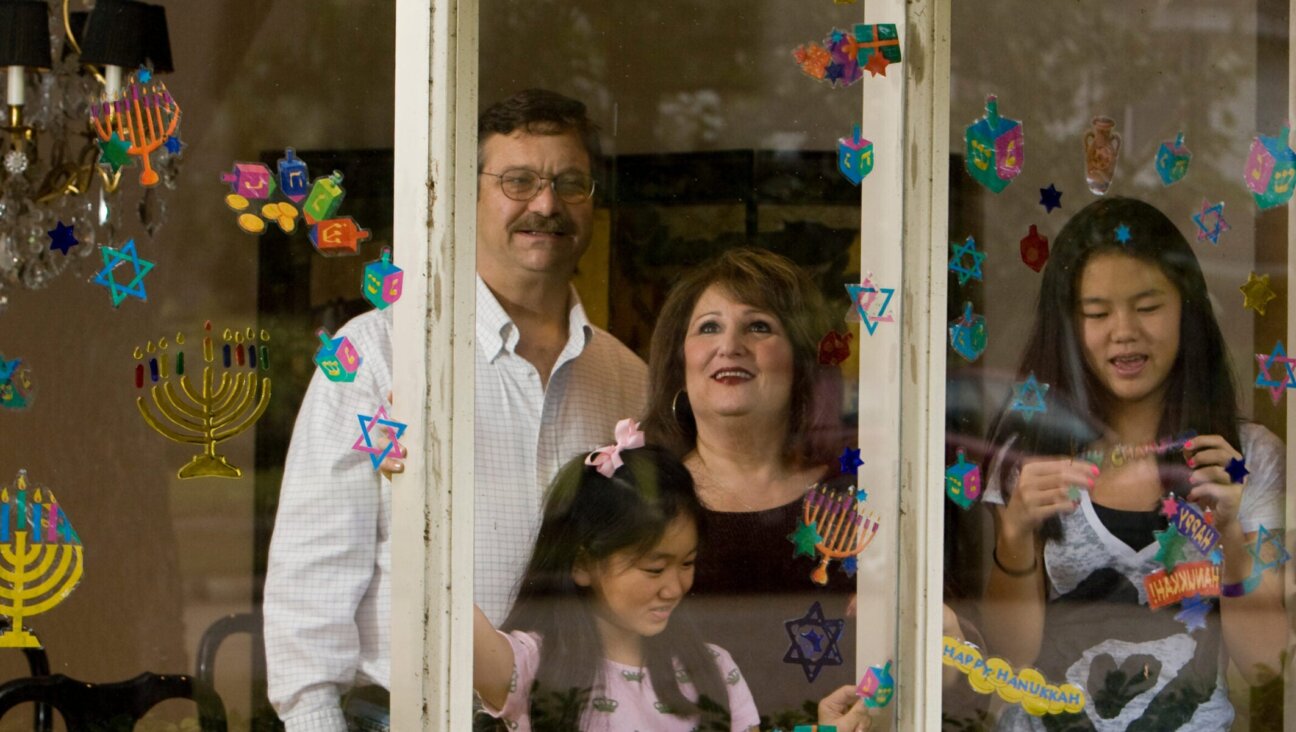 A Jewish family decorates their windows for Hanukkah in Houston in December 2008. 