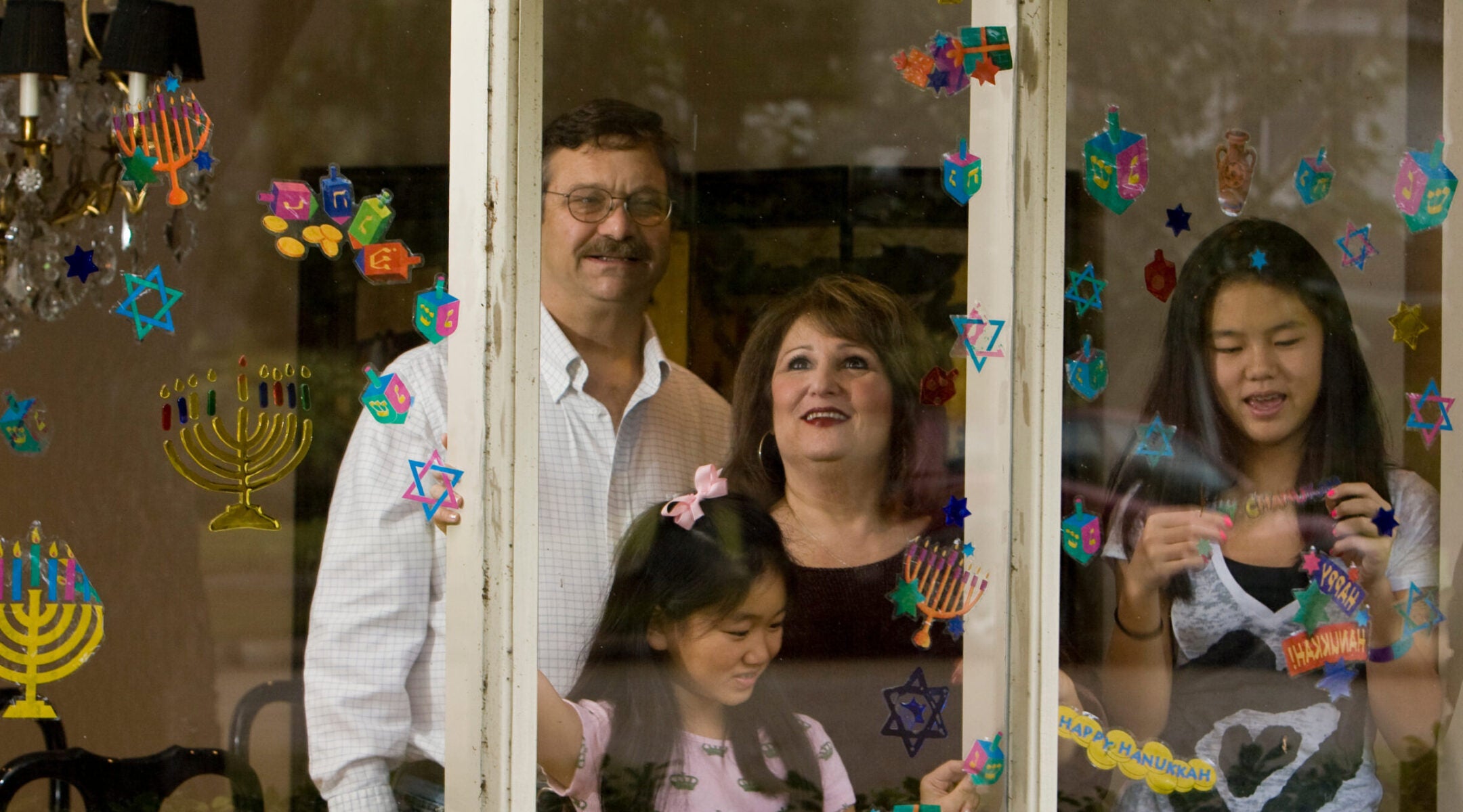 A Jewish family decorates their windows for Hanukkah in Houston in December 2008. 