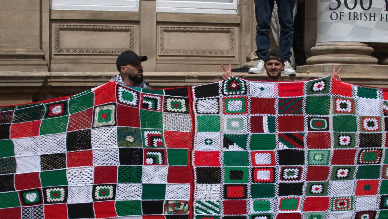 Irish demonstrators hold up a quilt symbolizing children who killed in Gaza during a pro-Palestinian rally in Dublin, July 19, 2025.