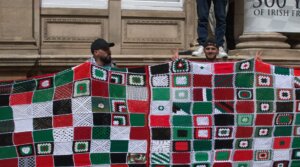 Irish demonstrators hold up a quilt symbolizing children who killed in Gaza during a pro-Palestinian rally in Dublin, July 19, 2025.